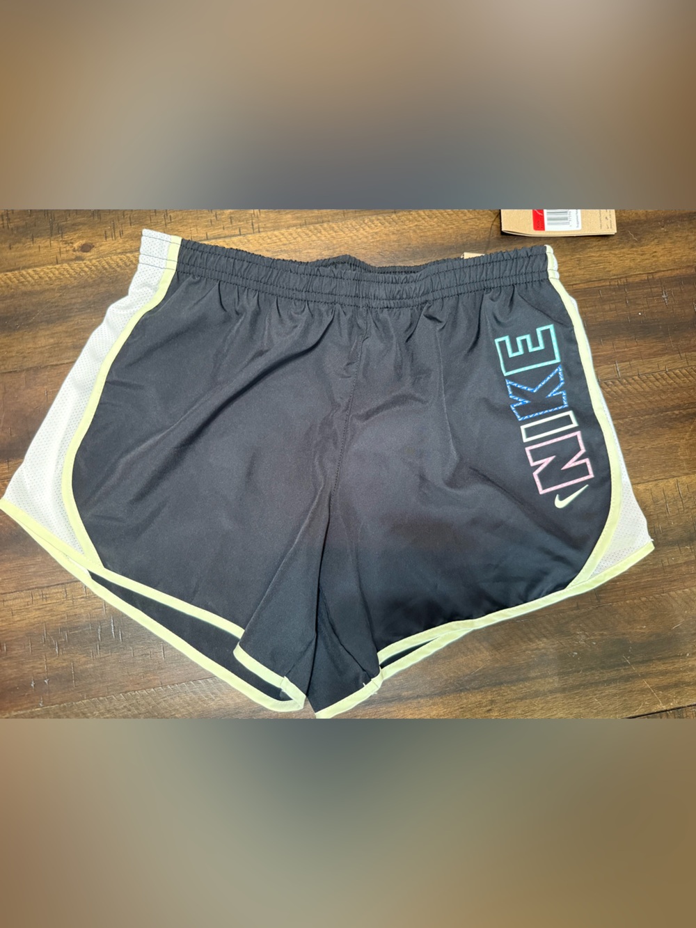 Kids Nike Black Shorts with Neon Yellow Piping and Multi-Color Logo
